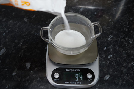 Scales marking the weight in grams of a bowl of sugar.の写真素材