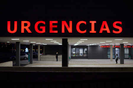 Entrance to a hospital emergency with an ambulance. Emergency sign in Spanishの写真素材