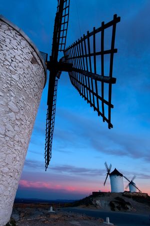 Windmills getting dark in Consuegra city, Toledo (Spain)の写真素材