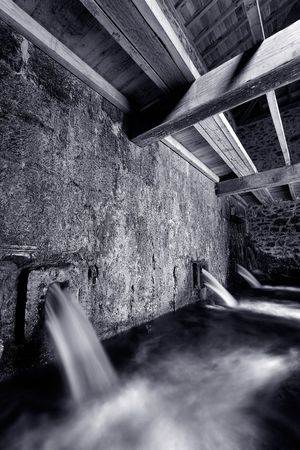 Inside of a water mill running の写真素材