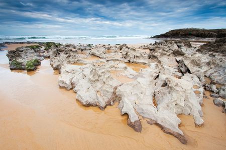 Rocks in the beach of Liencres, Cantabria, Spainの写真素材