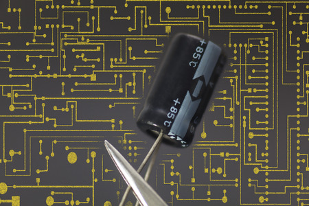 Electronic capacitor in black background