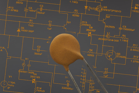 Electronic capacitor in black background