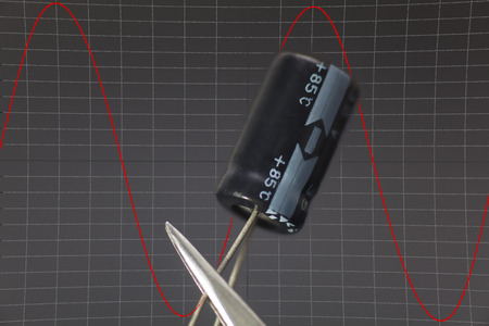 Electronic capacitor in black background