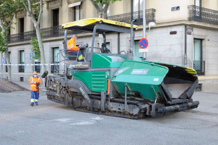 Madrid, Spain - 14 May 2020: Men working on the pavement in a street in Madrid, Spain during the confinement by Covid-19のeditorial素材
