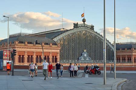 Madrid, Spain - June 5, 2020: Atocha train station. At the crosswalk
people wear face masks around the Covid-19のeditorial素材