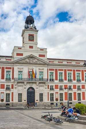 Madrid, Spain - June 8, 2020: Front view of the Palace of the Presidency of the Community of Madrid in Puerta del Sol. Some people wear face masks to protect themselves from Covid-19.のeditorial素材