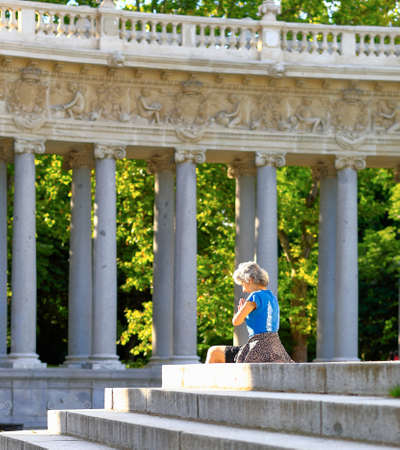 Madrid, Spain - June 17, 2020: Woman meditates and prays in the Retiro park on a sunny spring morningのeditorial素材