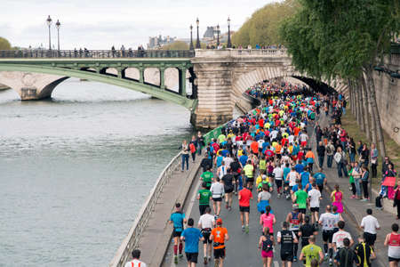 Marathon runners by the riverside in Parisのeditorial素材