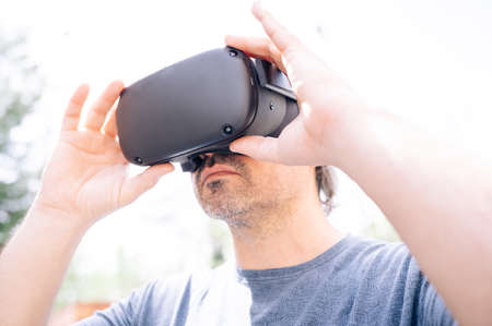 Man playing with virtual reality goggles.
