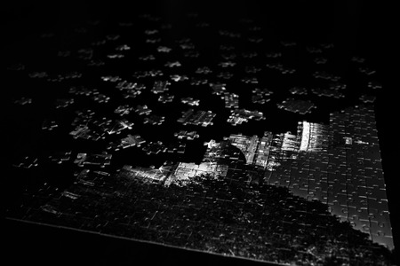 Pieces of a puzzle in black and whiteの写真素材