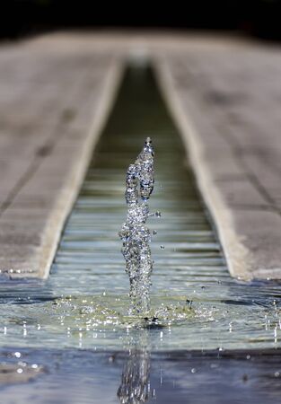 A small little fountain in the middle of the groundの写真素材