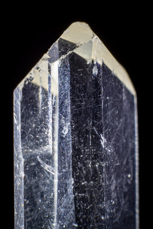 Close up on a transparent prism of gypsum with a black backgroundの写真素材
