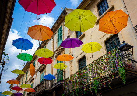 A street of Soller, Mallorca, full of colorful umbrellasの写真素材