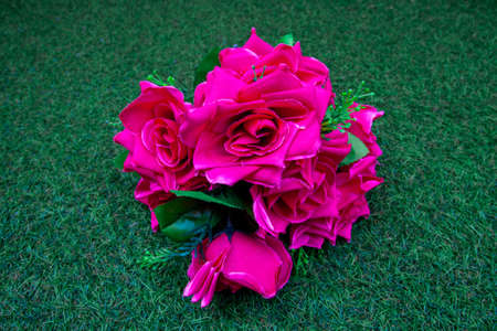 bouquet of roses on grassの写真素材