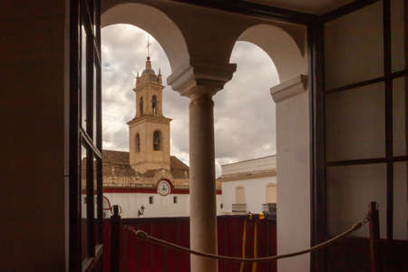 View of the tower of the Nuestra SeÃ±ora de Las Nieves parish church from the Olivares town hall.の写真素材