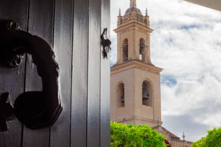 View of the tower of the Nuestra SeÃ±ora de Las Nieves parish church from the Olivares town hall.の写真素材