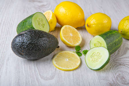Good food for health and diet cucumber,lemon,ginger and avocado on white background