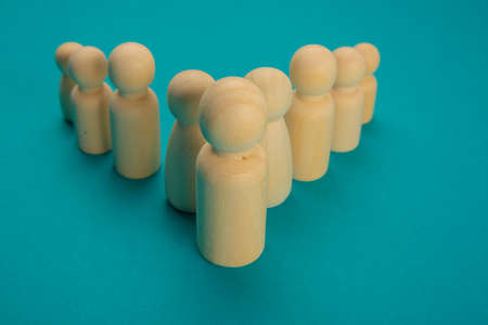 Groups of wooden tokens simulating people of different types grouped in a demonstration