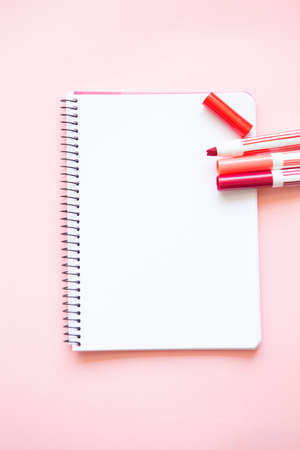 felt-tip pens of different shades of red and pink on a white backgroundの写真素材