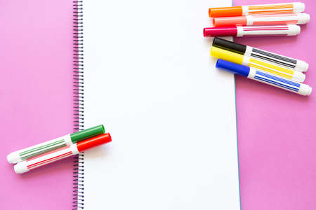 different colored felt pens on blank pageの写真素材