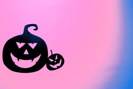Group of hand painted black pumpkins on a colored backgroundの写真素材