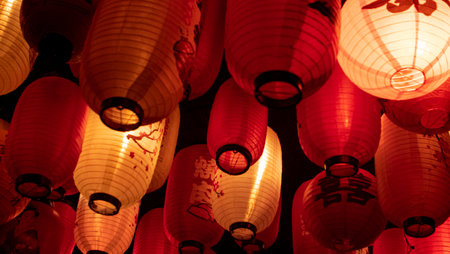 Photorealistic detail of red and white paper lanterns with Japanese letters and signs.の写真素材