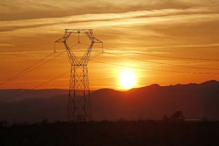 sunset on the electrical towerの写真素材