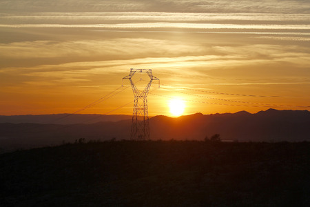 sunset on the electrical towerの写真素材