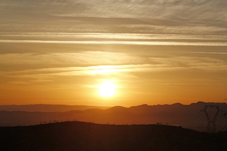 sunset on the electrical towerの写真素材