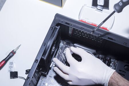 new cpu is being mounted unto the motherboard. Installing Memory Ram slots, microprocessor and...