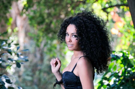 Portrait of a young black woman in the parkの写真素材