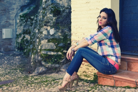Portrait of a young beautiful woman in a urban background の写真素材