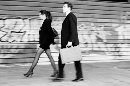 Atractive business people walking in the street  Couple working の写真素材
