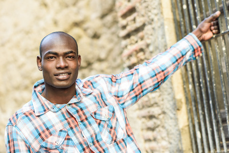 Portrait of black man wearing casual clothes in urban backgroundの写真素材
