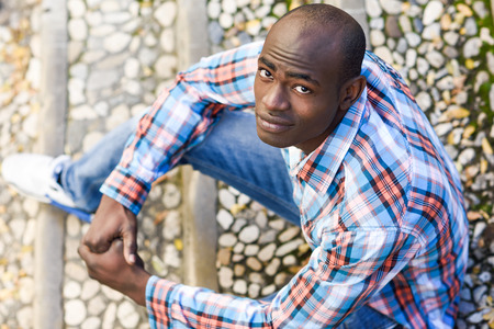 Portrait of black man wearing casual clothes in urban backgroundの写真素材