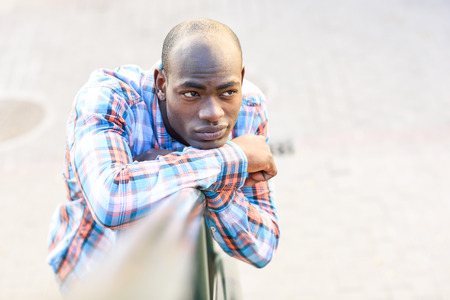 Portrait of black man wearing casual clothes in urban backgroundの写真素材