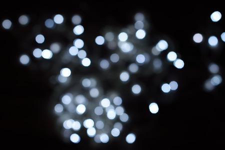 White glitter bokeh lights defocused backgroundの写真素材