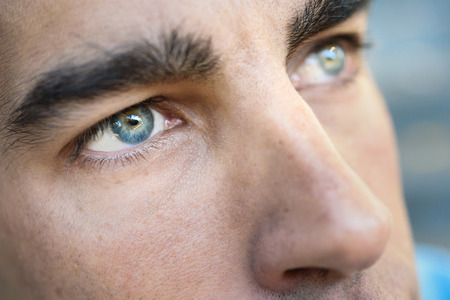 Close-up shot of man's eye. Man with blue eyes.の写真素材