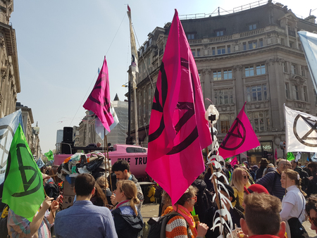 London, United Kingdom, April 15th 2019:- Extinction Rebellion protesters block in Oxford Circus in central London to protest the current environmental emergencyのeditorial素材