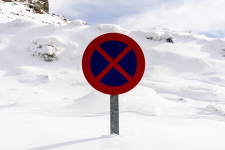 Snowed road sign no parking in Sierra Nevadaの写真素材