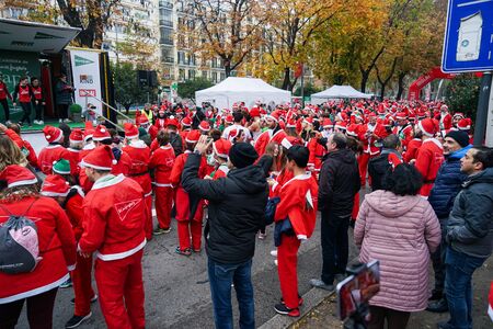 Madrid, Spain, December 8th 2019: Crowd of Santa Clauses running in streetのeditorial素材