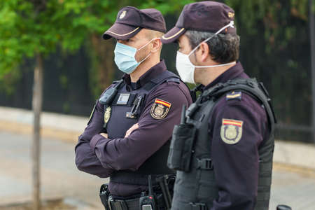 Spanish police with protective masks due to Coronavirus.