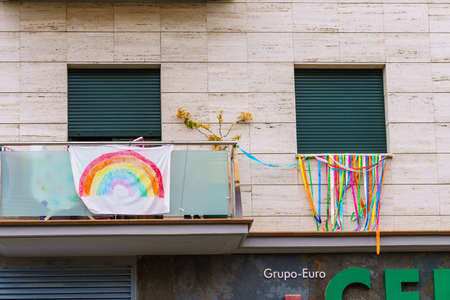 Rainbow drawing in the facade symbol of hope during Covid-19 outbreakのeditorial素材