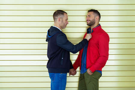 Gay couple in a romantic moment on the street.の写真素材