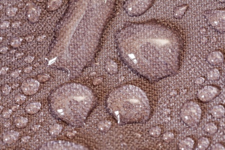 Water drops in a waterproof clothの写真素材