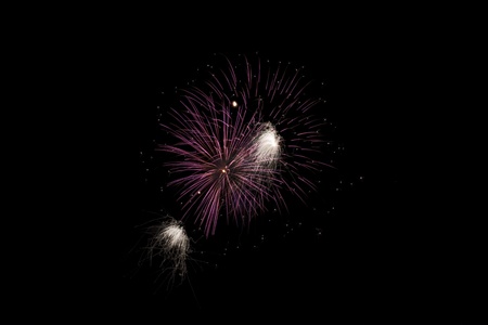 Colorful fireworks isolated over a dark backgroundの写真素材