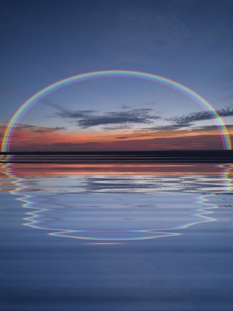 Blue sunset in the ocean with water reflections