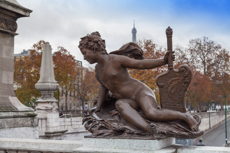 Sculpture in the Alexandre III Bridge in Paris, France.の写真素材