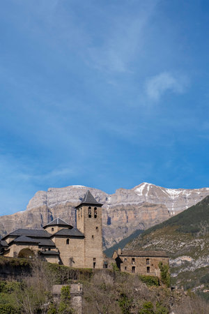 Torla, typical pyrenean village with stone houses with the mountains in the background, gateway to the Ordesa and Monte Perdido National Park in the Spanish Pyrenees, Aragon, Spain, verticalの写真素材